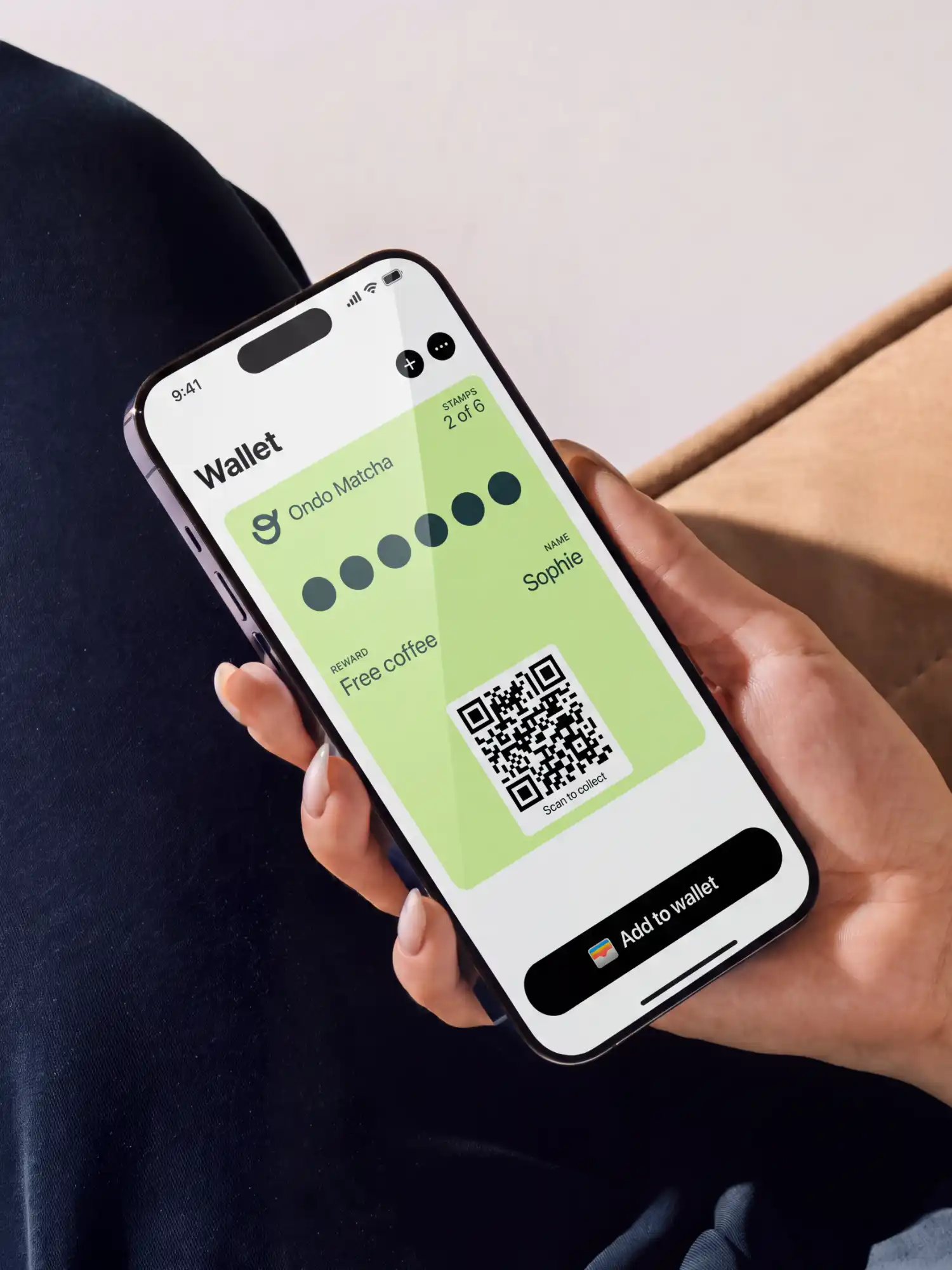 An Ondo Matcha stamp card in Apple Wallet, 2 of 6 stamps, held in a customer's hand